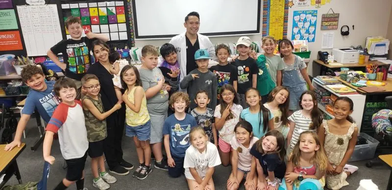 Dr. Suarez with class of kids