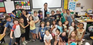 Dr. Suarez with class of kids