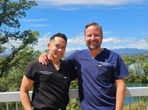Both oral Surgeons smiling